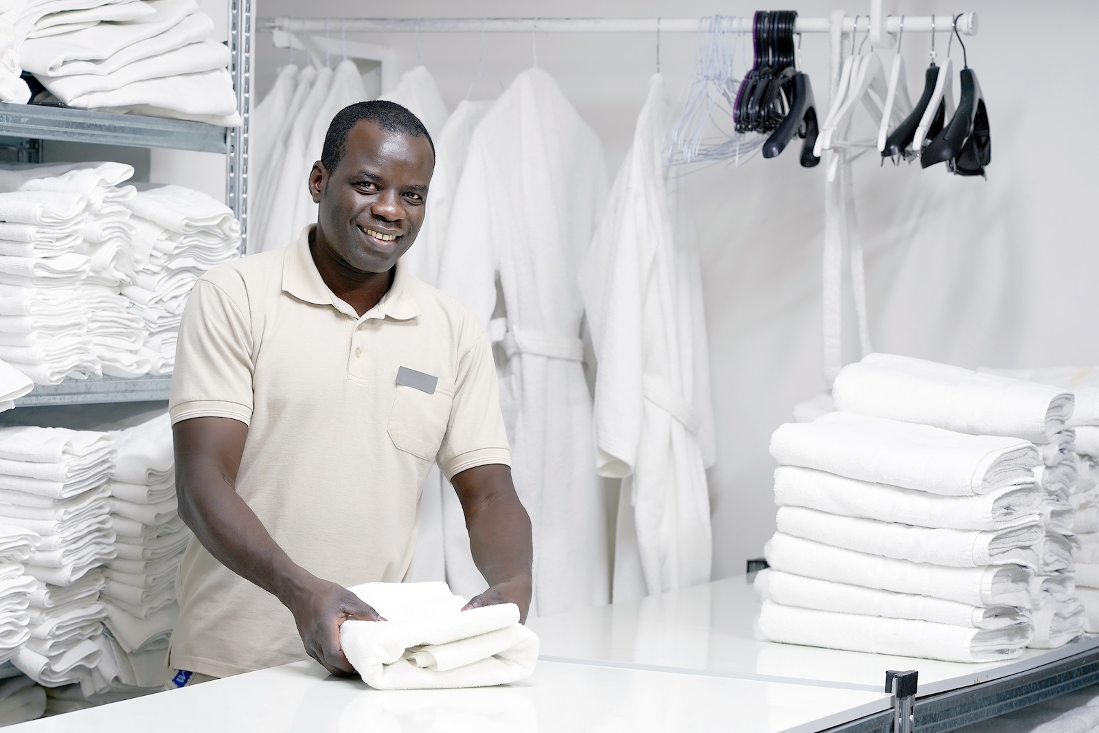 bigstock-African-Male-Hotel-Worker-Fold-275921560-1